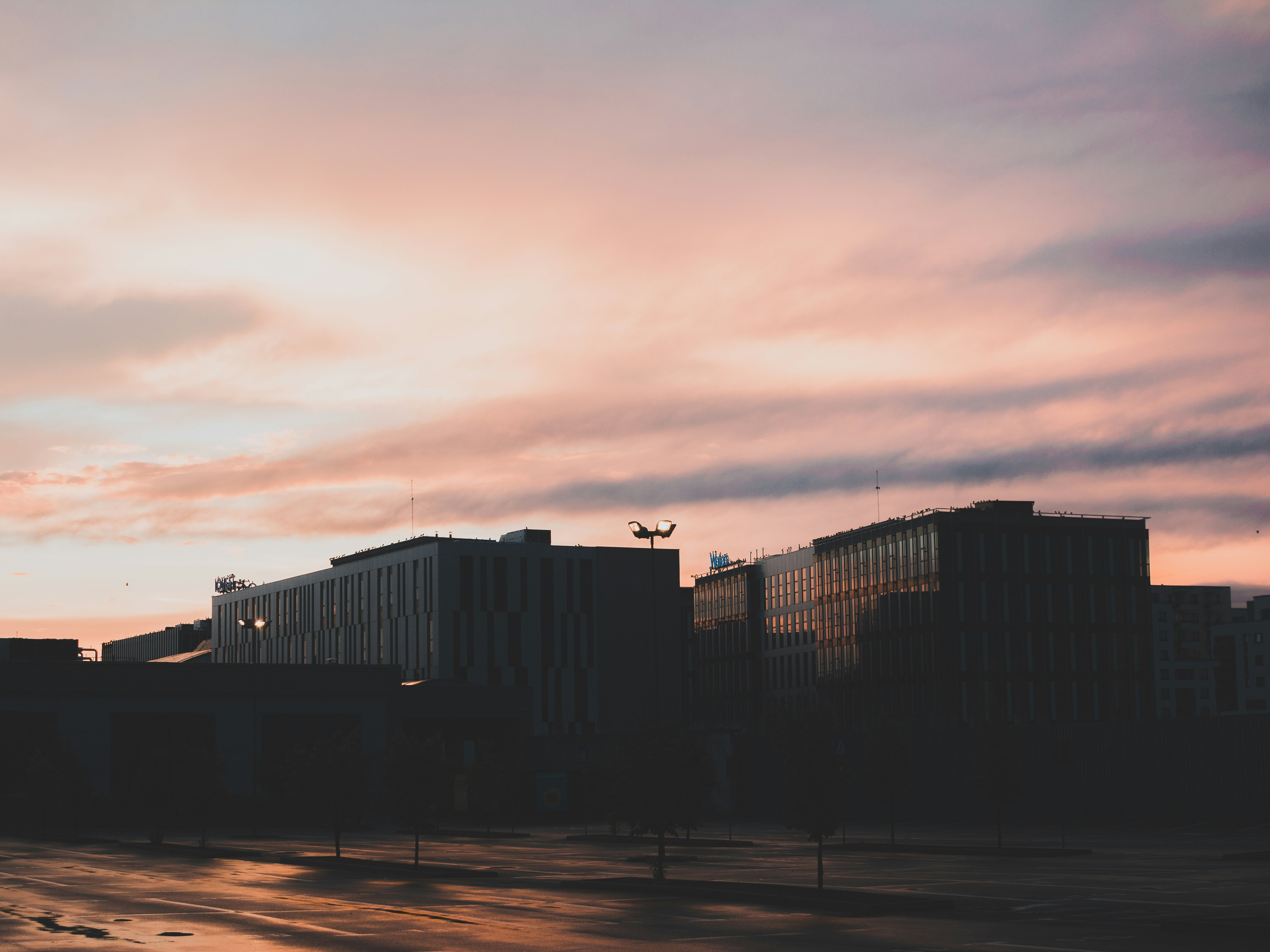 silhouette of buildings during sunset